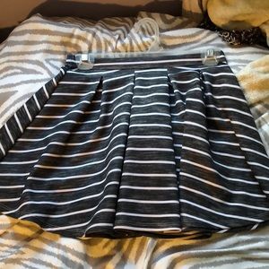 A grey skirt with white stripes